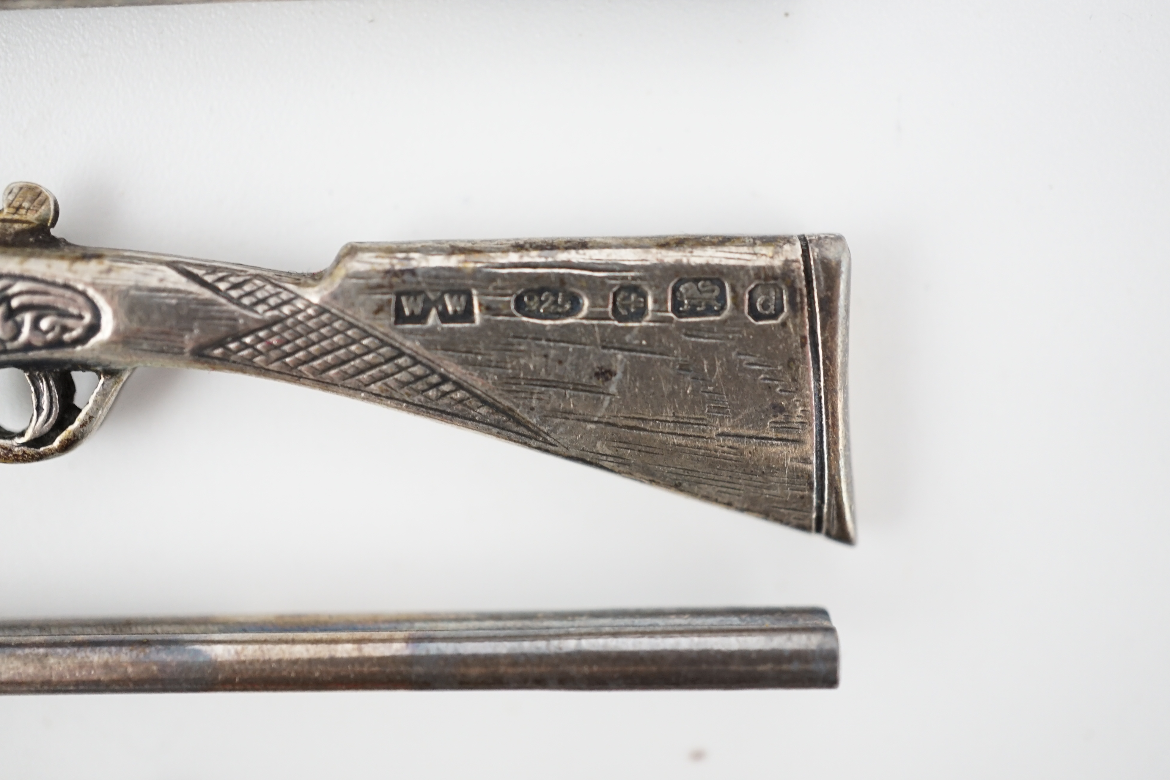 A modern set of eight novelty silver butt markers, modelled as double barrelled shotguns
